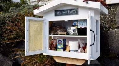 A food pantry in front of a house.
