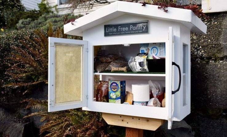 A food pantry in front of a house.