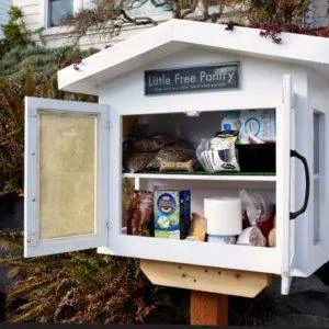 A food pantry in front of a house.