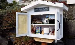 A food pantry in front of a house.